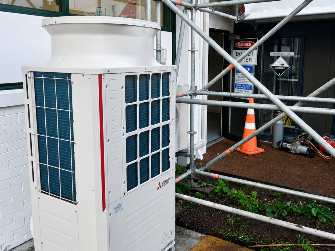 A Mitsubishi Electric City Multi commercial heat pump installed on a site