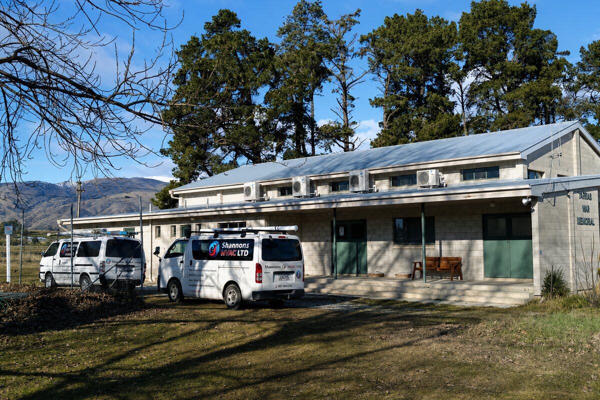 Two Shannons HVAC vans at a rural Central Otago property with heat pumps installed along the wall